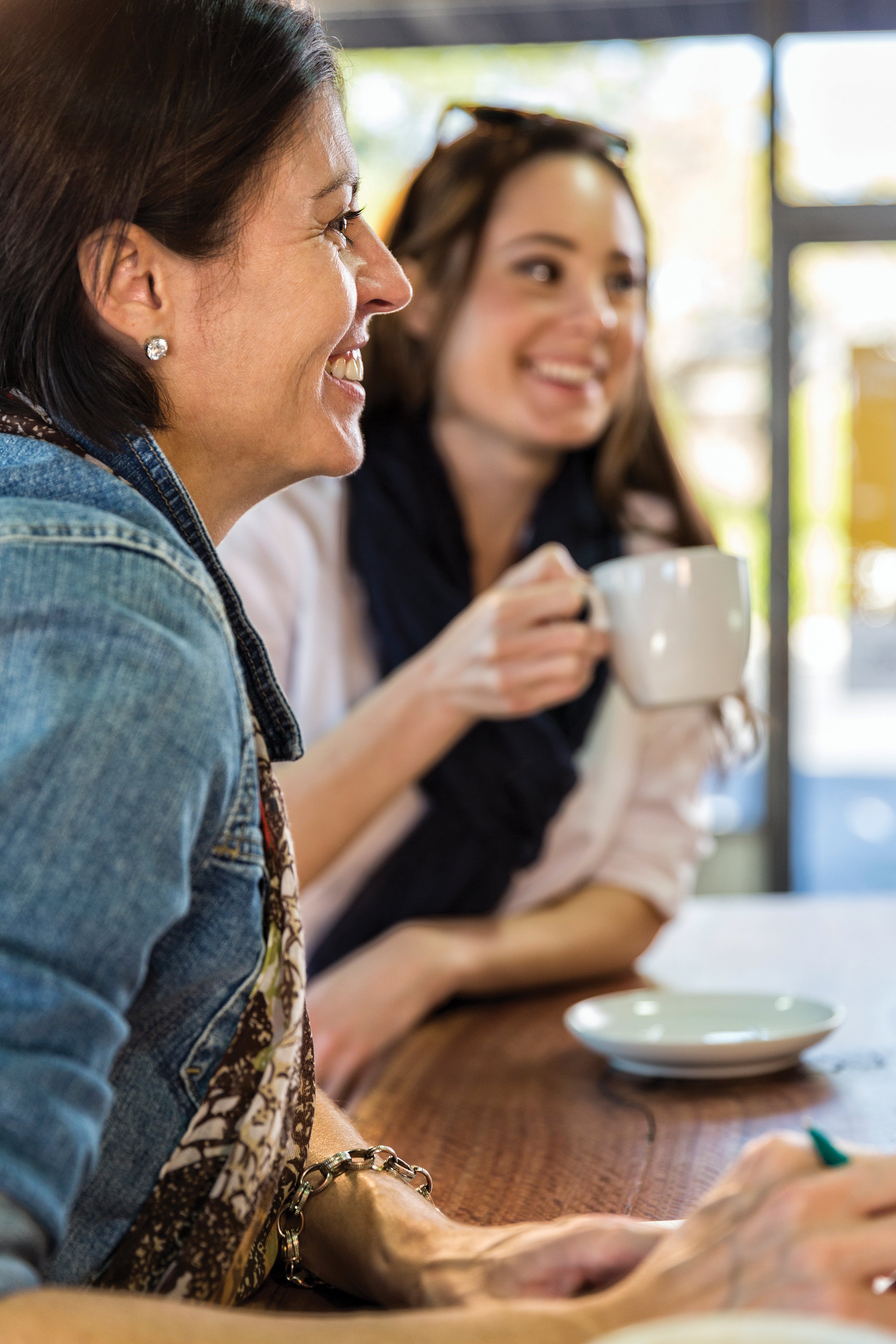 Two women sharing a coffee.