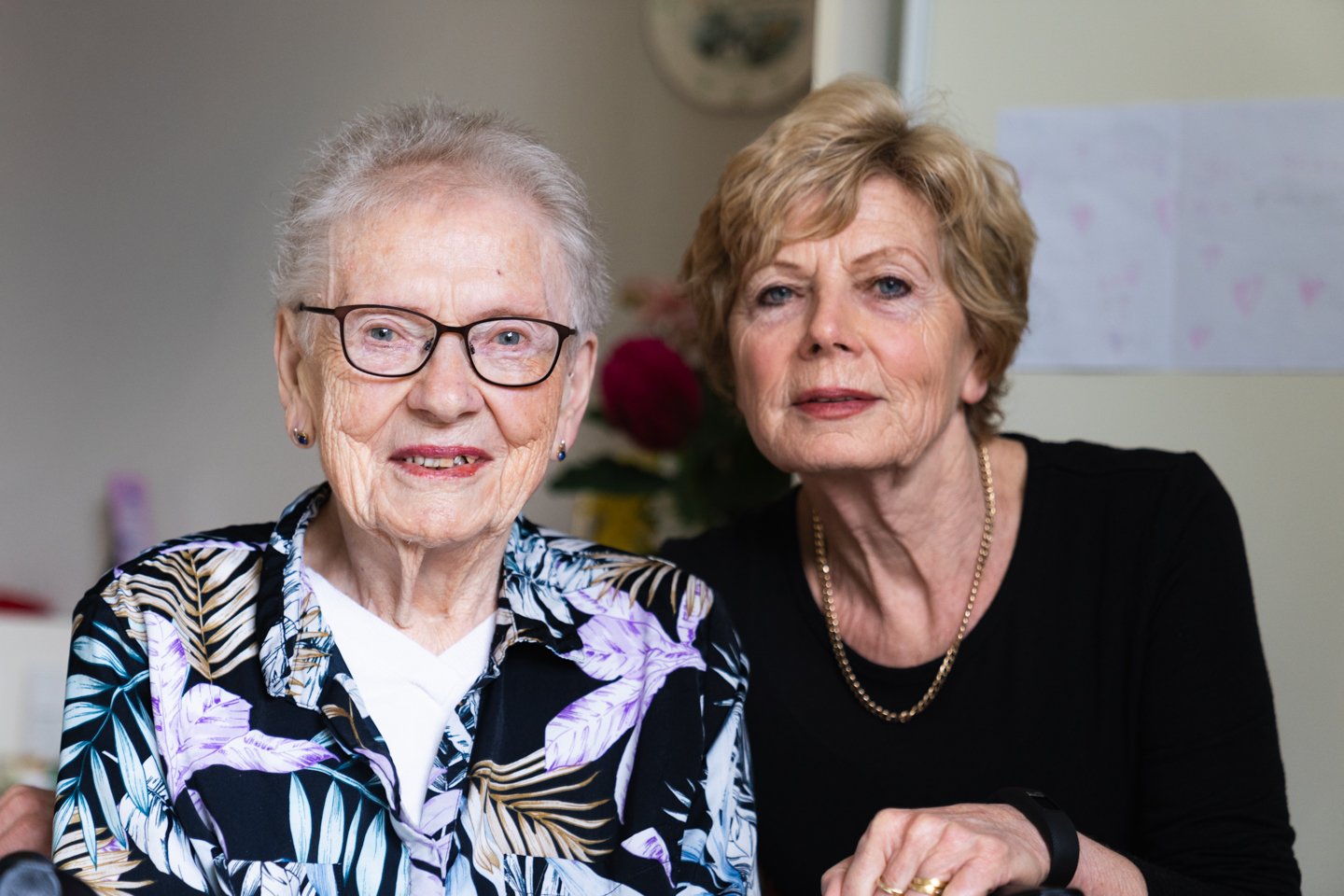 Image of female resident on the left with female visitor on the right